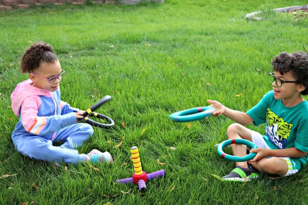 Kids playing ring toss