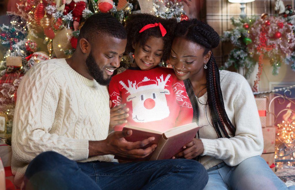 Family Reading Christmas Books Together