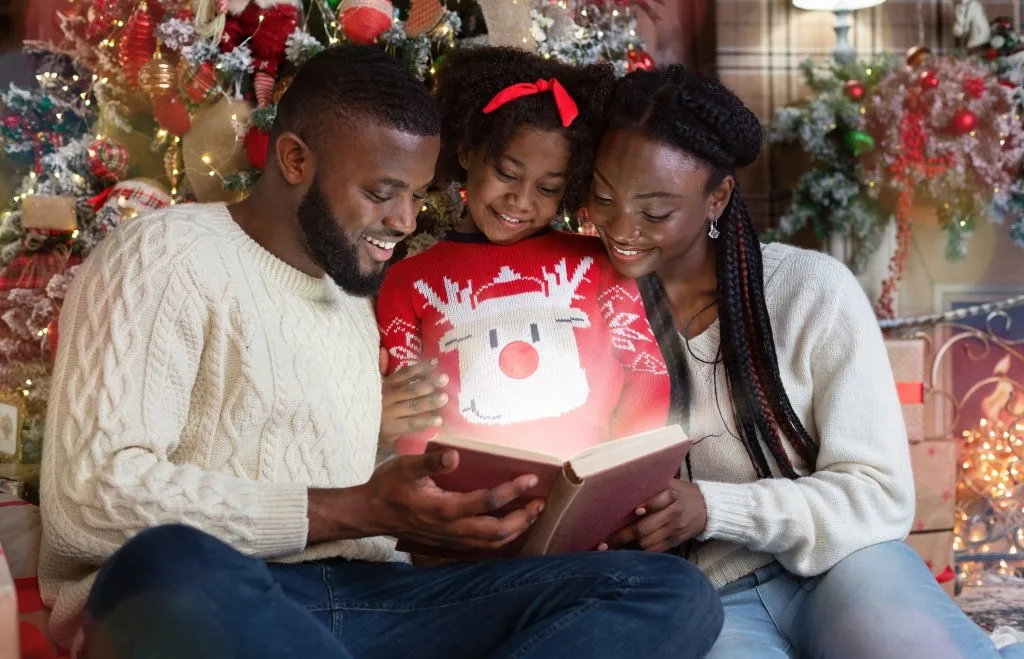 Family Reading Christmas Books Together